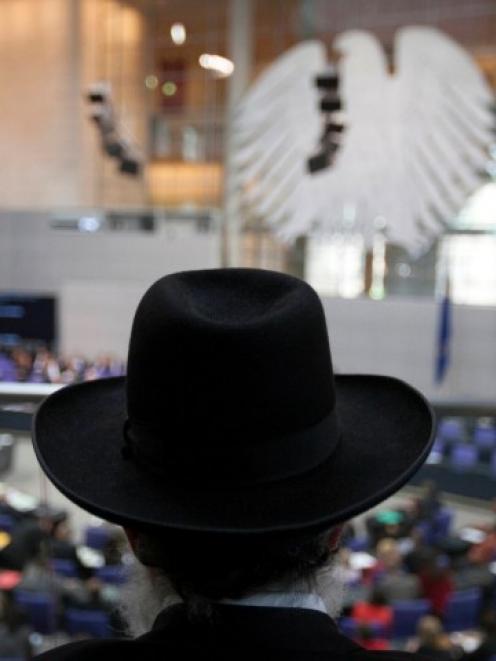 Rabbi Netaniel Wurmser of the Wurttemberg rabbinate listens to a debate about a proposed...