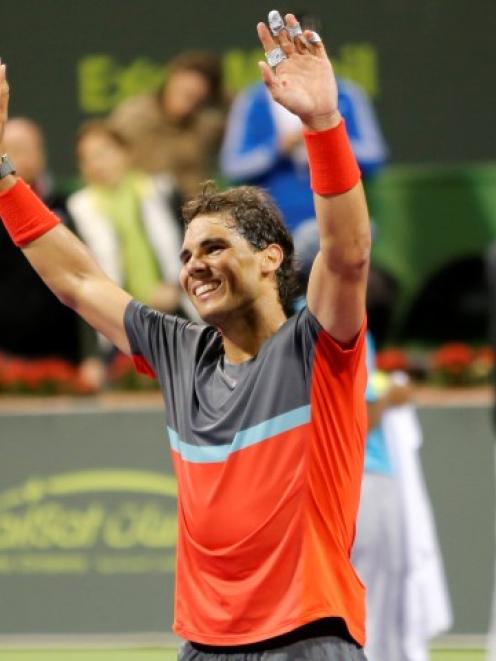 Rafael Nadal celebrates his victory in the Qatar Open final. REUTERS/Ahmed Jadallah