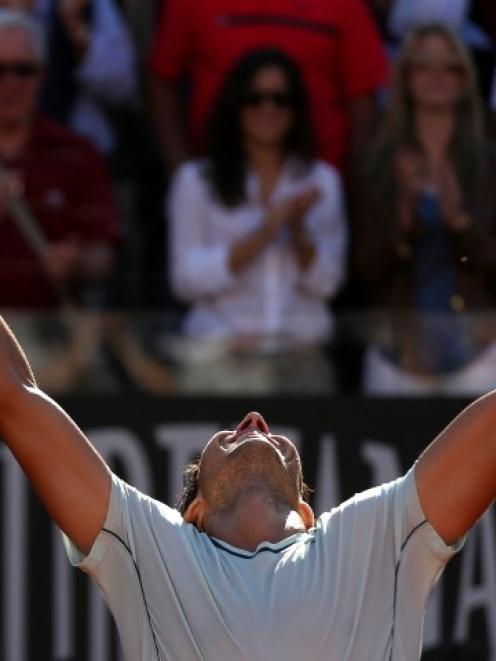 Rafael Nadal of Spain celebrates after winning the men's singles final match against Roger...