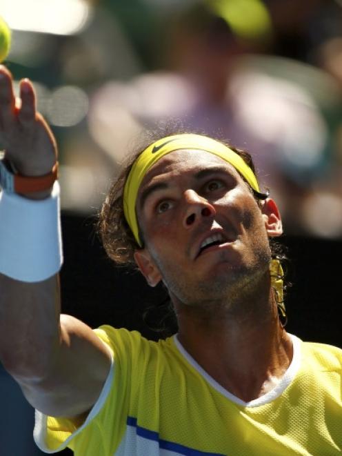 Rafael Nadal serves at the Australian Open. Photo: Reuters