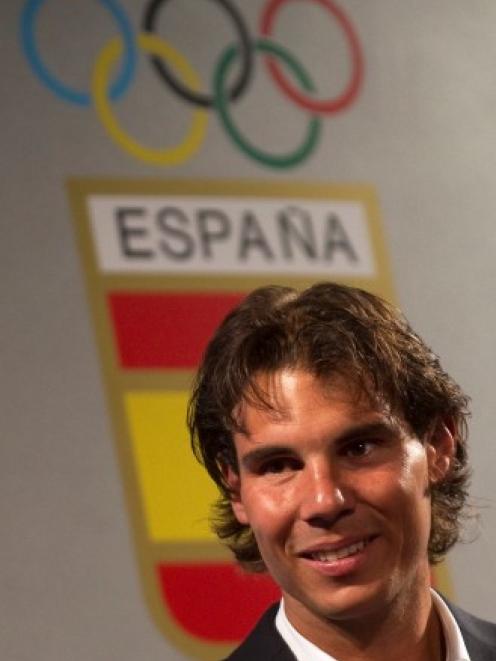 Rafael Nadal, who was to have been the official Spanish flag bearer at the London Olympics, at a...