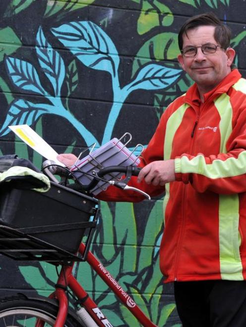 Rain, hail and shine, postie John Kingan has been on the road delivering post to Mosgiel...