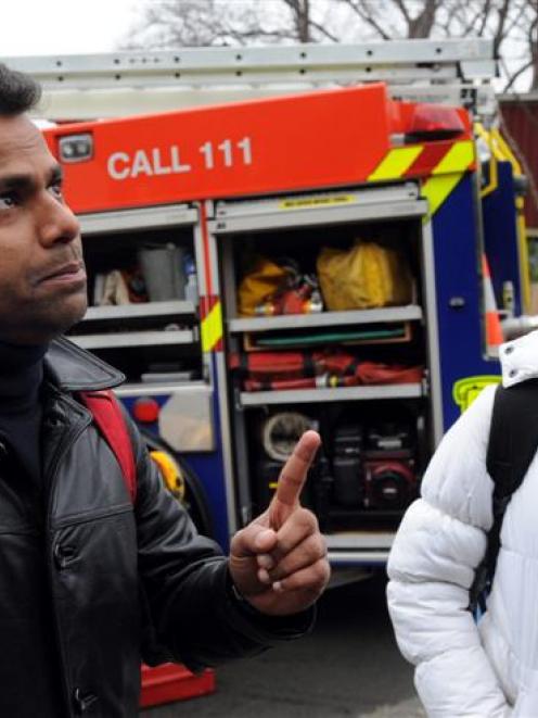 Ramakrishnan Mani (left) and Divya Adhia after saving their home from a suspected arson attack...