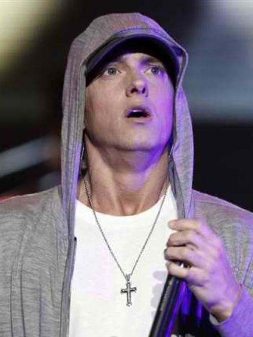 Rapper Eminem performs at a concert celebrating the launch of the video game "DJ Hero" in Los...
