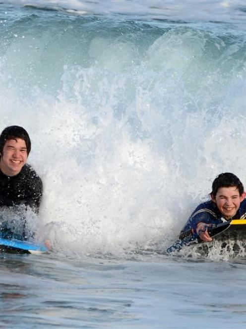 Rapson Tupuhi (left) and Josh Rose enjoy St Kilda's waves during yesterday's winter respite....