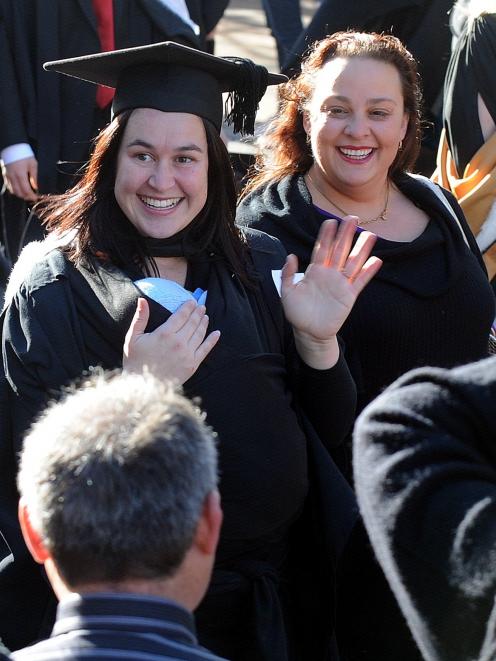 Raquel Buckley (29,  left) holds her 4-week-old baby Noah Buckley as she takes part in the...