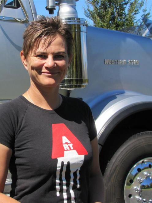Real Art Road Show's Fiona Campbell with one of the big rigs that transport her art collection....