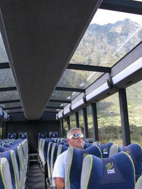 Real Journey's coach services manager David Osborne admires the view through the ceiling of the...