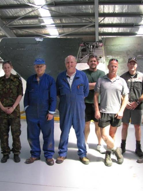 Rebuilding a decommissioned air force Skyhawk in Wanaka this week, (from left) Chris Watty and...