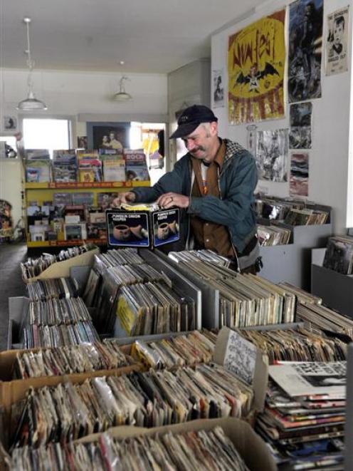 Records Records owner Patrick Faigan prepares his remaining stock yesterday for sale. The shop is...