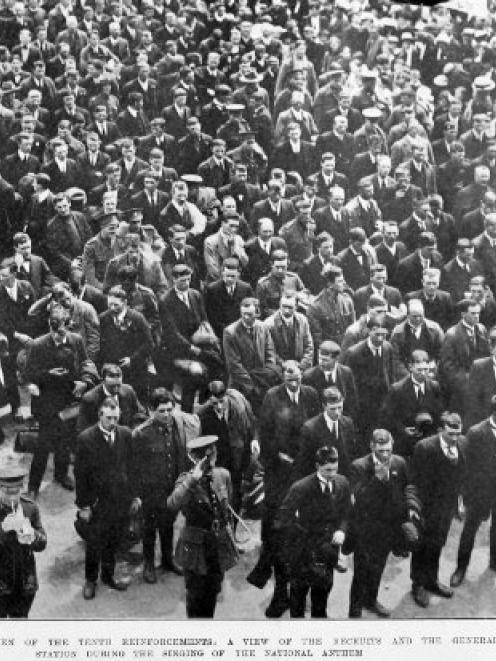 Recruits and members of the general public as the National Anthem is sung outside the Dunedin...