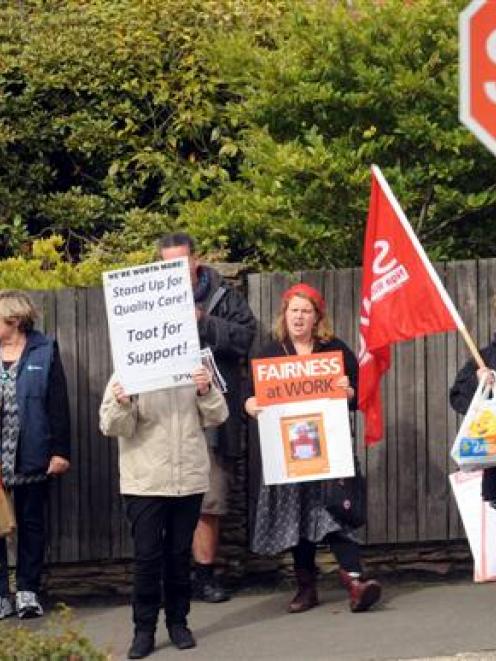 Redroofs workers and supporters form a picket line yesterday outside the rest-home. Photo by...