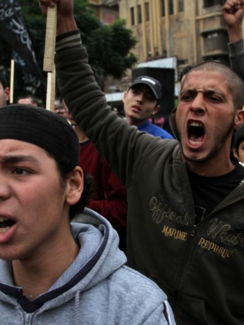 Relatives of Lebanese who had gone missing in Syria chant slogans during a protest to enquire...