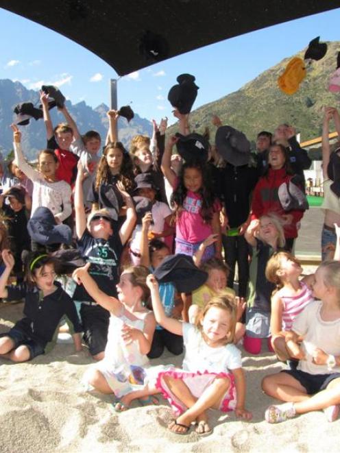 Remarkables Primary School pupils celebrate getting one of their new shade sails in February. The...