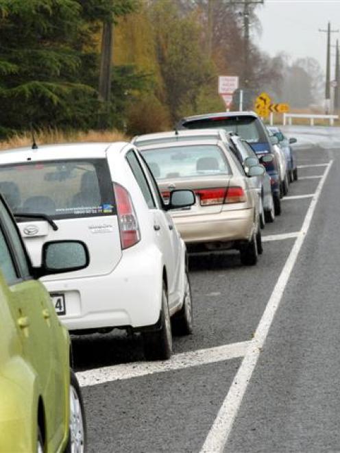 Rental cars parked in Miller Rd, near the turn-off to Dunedin International Airport, yesterday....
