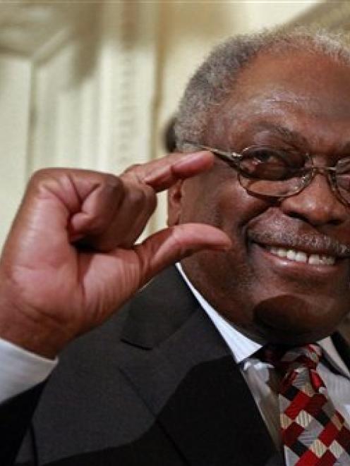 Rep. James Clyburn gustures as he walks through statuary hall as the House prepares to vote on...