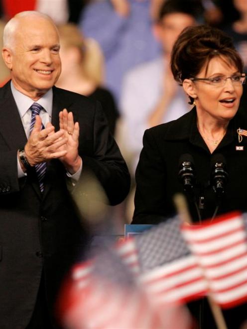 Republican Alaska Gov. Sarah Palin speaks as Republican presidential candidate, Sen. John McCain,...