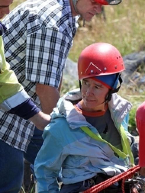 Rescuers help pull Jill Clendon from the sinkhole on Takaka Hill, near the Ngarua Caves. Photo /...