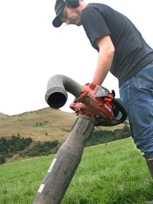Research scientist Scott Hardwick collects clover root weevils from South Canterbury pasture...