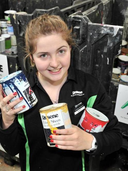 Resene ColorShop Dunedin  saleswoman Robyn Warburton (21) holds paint ready for recycling. Photo...