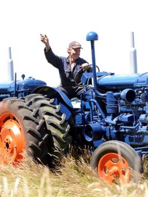 Retired farmer Malcolm Mouat, of Dunedin, takes his tandem tractor for a test run yesterday...