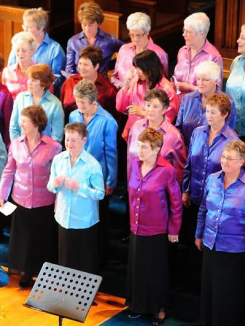 Retiring Dunedin Star Singers' musical director Dulcie Gunn (front) accepts applause at Knox...