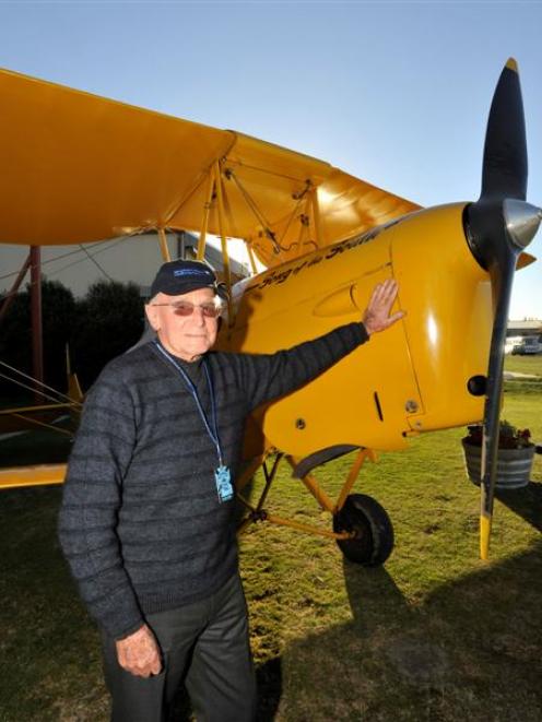 Returned serviceman Mack Swinburn (93), of Waipukurau, prepares for a flight in a Tiger Moth. ...