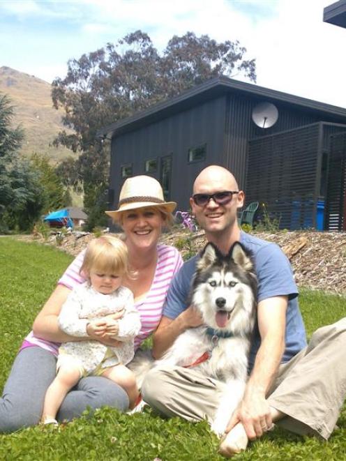 Reunited in Kingston yesterday with their dog Wolf are Ryan, Kirsteen and Willow (1) Watt. Photo...