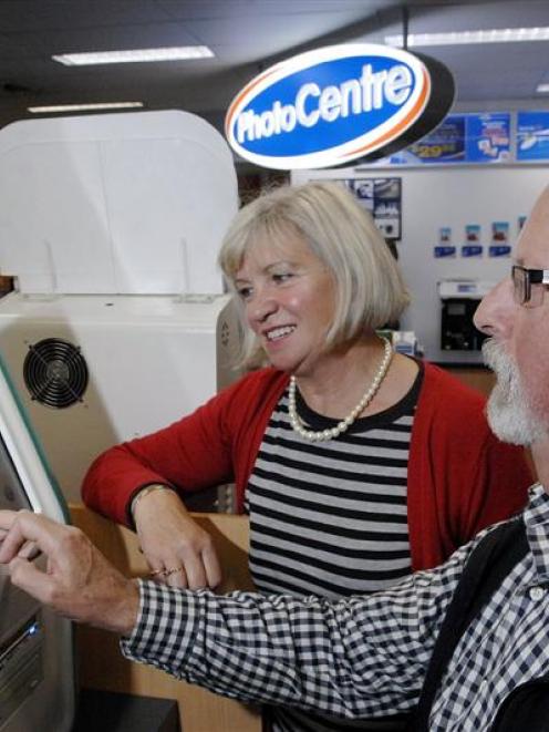 Ria (64) and Gerald Schouten (63), of Balclutha, select family digital photos for printing at...