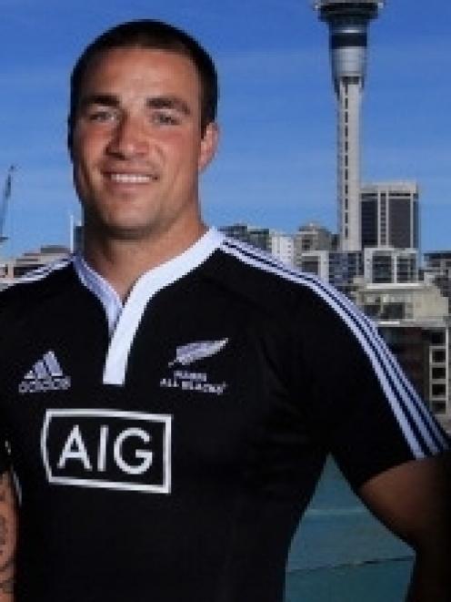 Richard Kahui models and All Black shirt with the AIG logo. Photo supplied