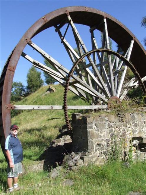 Richard Pringle wants to see the historic water wheel in Old Mill Rd restored. Photo by Sally Rae.