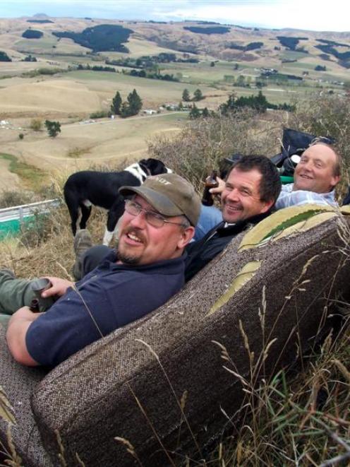 Richard Robinson (left), Ken Fergusson and Johnny Bell put their feet up at the North Otago dog...