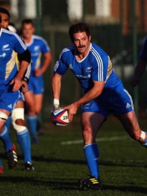 Richie McCaw of the All Blacks runs through drills during a training session at Latymers Upper...