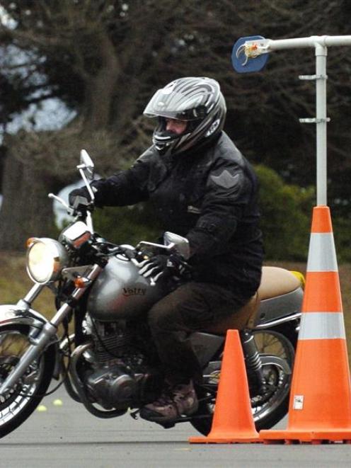 Ride Right Otago participant Ron Esplin steers around the cones at the motorcycle safety course...