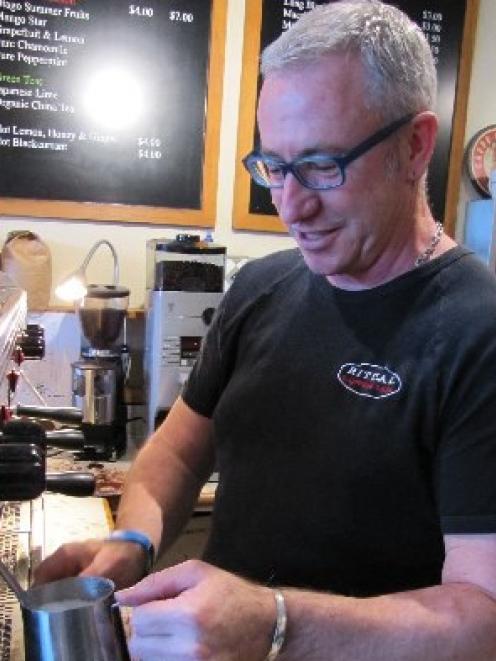 Ritual Cafe co-owner Chris Hadfield works his coffee machine in Wanaka. His cafe has gone through...