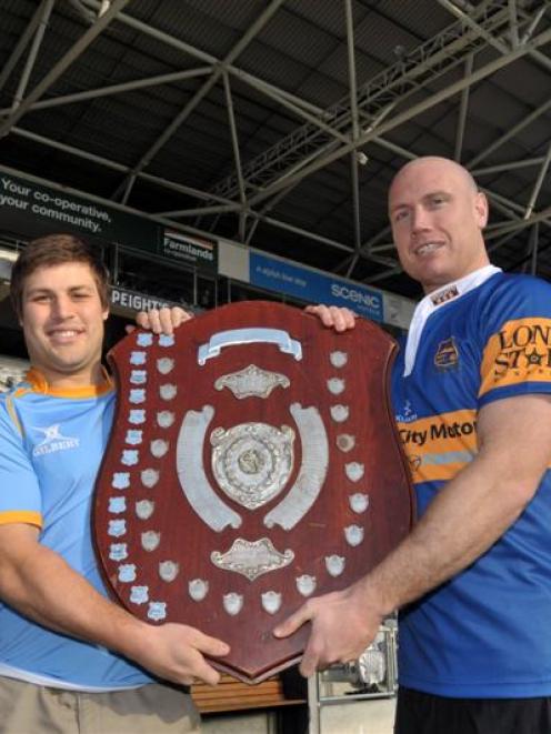 Rival captains Sam Sturgess (University A, left) and Charlie O'Connell (Taieri) hold the Speight...