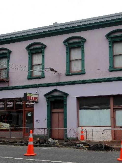 Road workers yesterday uncovered what is thought to be the basement of an 1860s hotel under this...