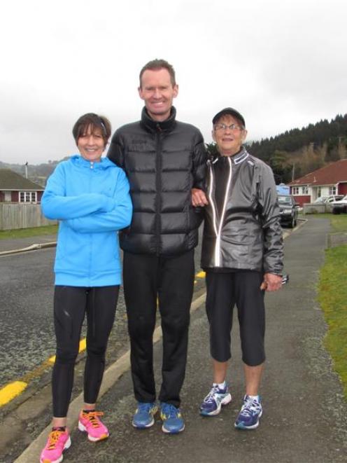 Robbie Johnston,  Stacey Pearson and her mother, Kay, near the finish of the Dunedin Marathon...
