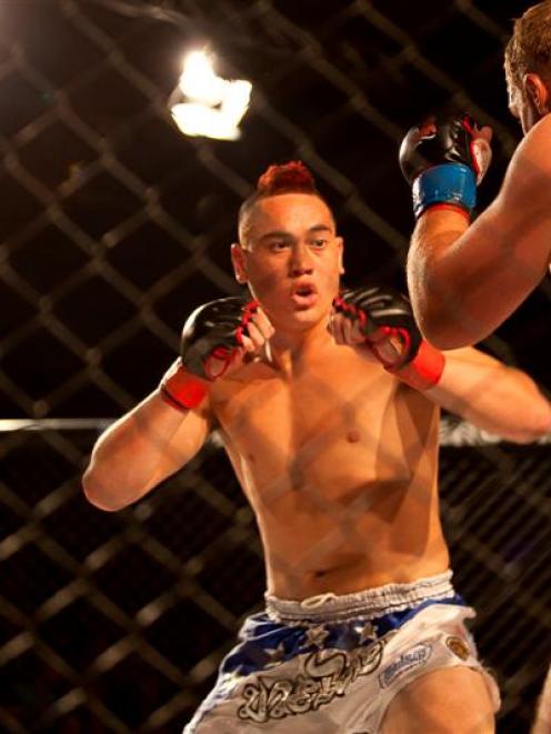 Robert Dean (left) faces BJ Bland during the fight night at the Caledonian gymnasium on Saturday....