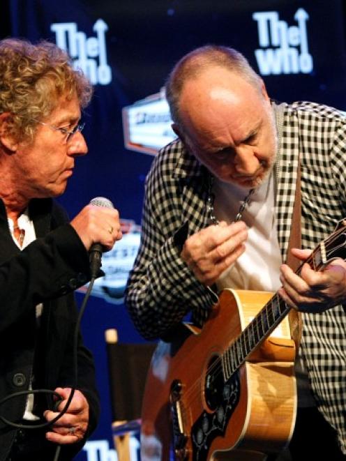 Roger Daltry, left, and Pete Townshend of The Who perform during a Super Bowl press conference in...