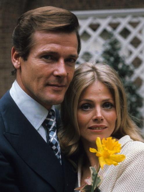 Roger Moore (James Bond) and Britt Ekland (Mary Goodnight) pose on the set of 'The Man With The...