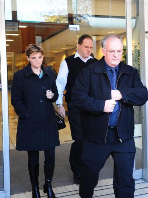 Roger Weatherston (front) is followed out of the High Court at Christchurch by daughter Angela...