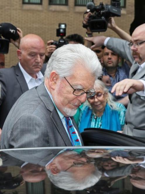 Rolf Harris, his daughter Bindi (L) and wife Alwen (2nd R) leave Southwark Crown Court in London....