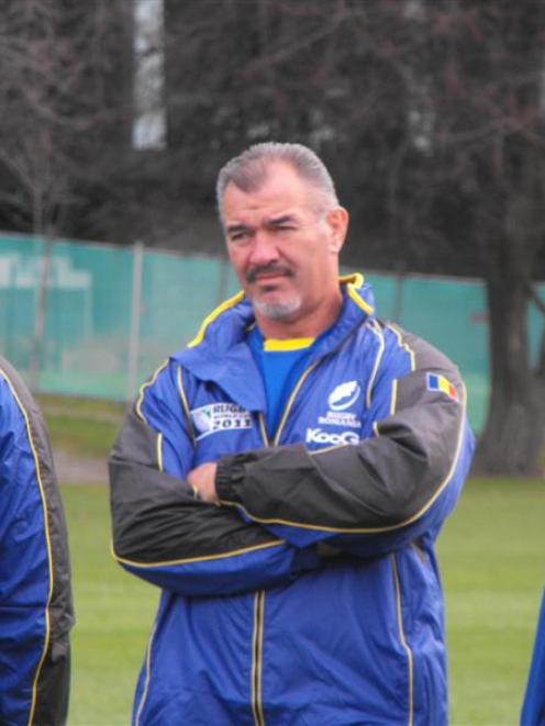 Romania assistant coach and former All Black prop Steve McDowell keeps watch on a training...