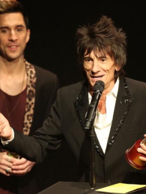 Ronnie Wood accepts the award for Best Music Film for 'Crossfire Hurricane' by the Rolling Stones...