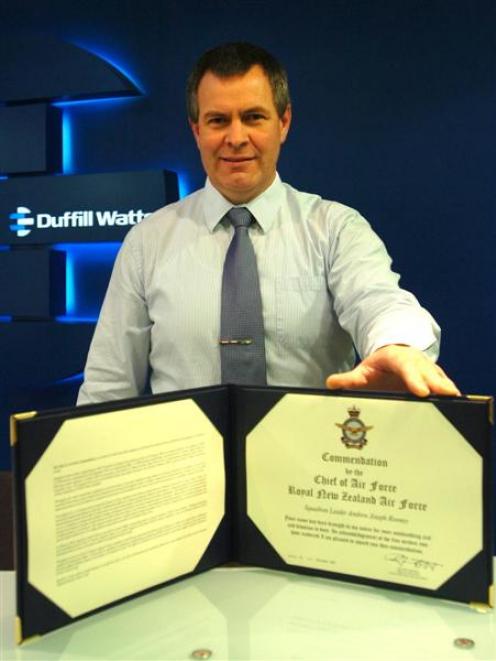 Former squadron leader Andrew Rooney displays his Chief of Air Force Commendation. Photo by Peter...