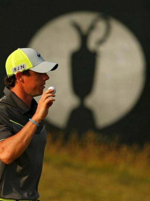 Rory McIlroy acknowledges the crowd after making a birdie putt on the 15th green. REUTERS/Cathal...