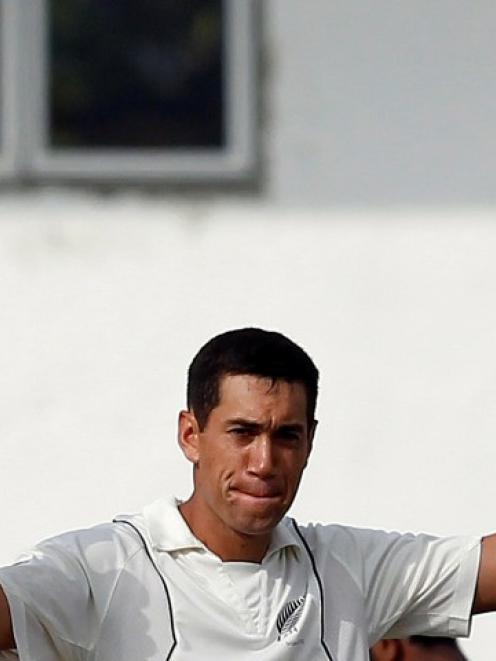 Ross Taylor celebrates after scoring a century during the first day of the second test against...