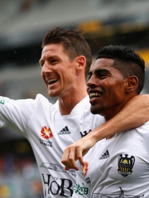 Roy Krishna of the Phoenix (R) celebrates his goal with Nathan Burns (L) during the round 11 A...