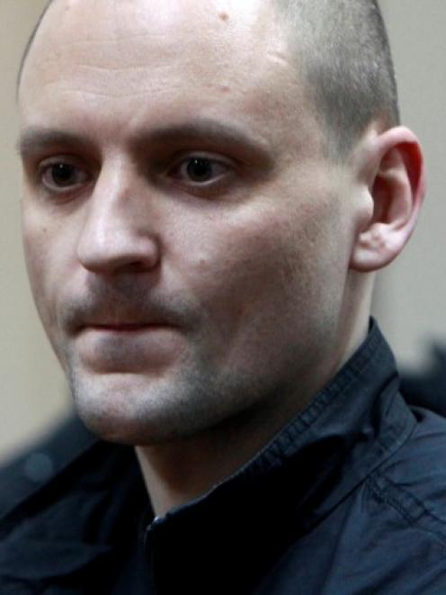 Russian opposition leader Sergei Udaltsov appears in court where he was put under house arrest...